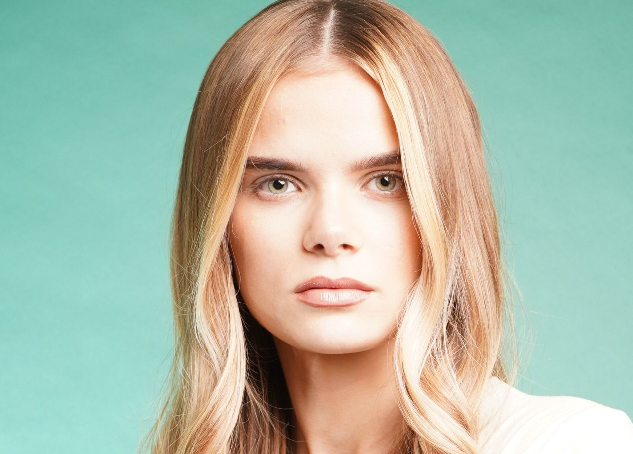 A model with flowing blonde waves at Jo Johnson Salon in London, England, GB, showcasing their expert styling.