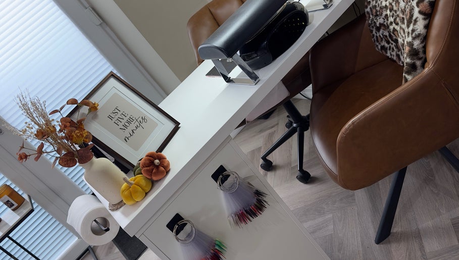 Elegant nail station at Toni Louise Beauty in Llanfairpwllgwyngyll, Wales, GB with decor and sign.