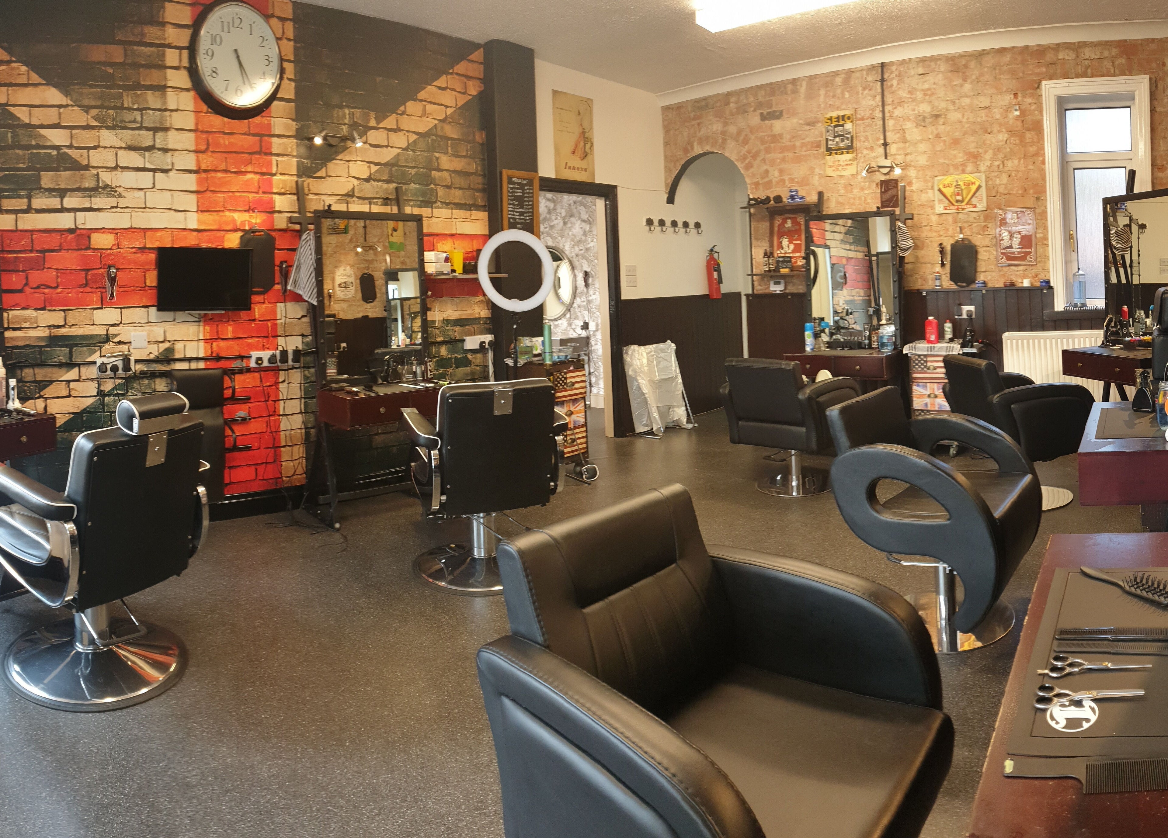 Modern hair salon at Sweeneys Catterick, Catterick Garrison, England, GB featuring stylish chairs and decor.