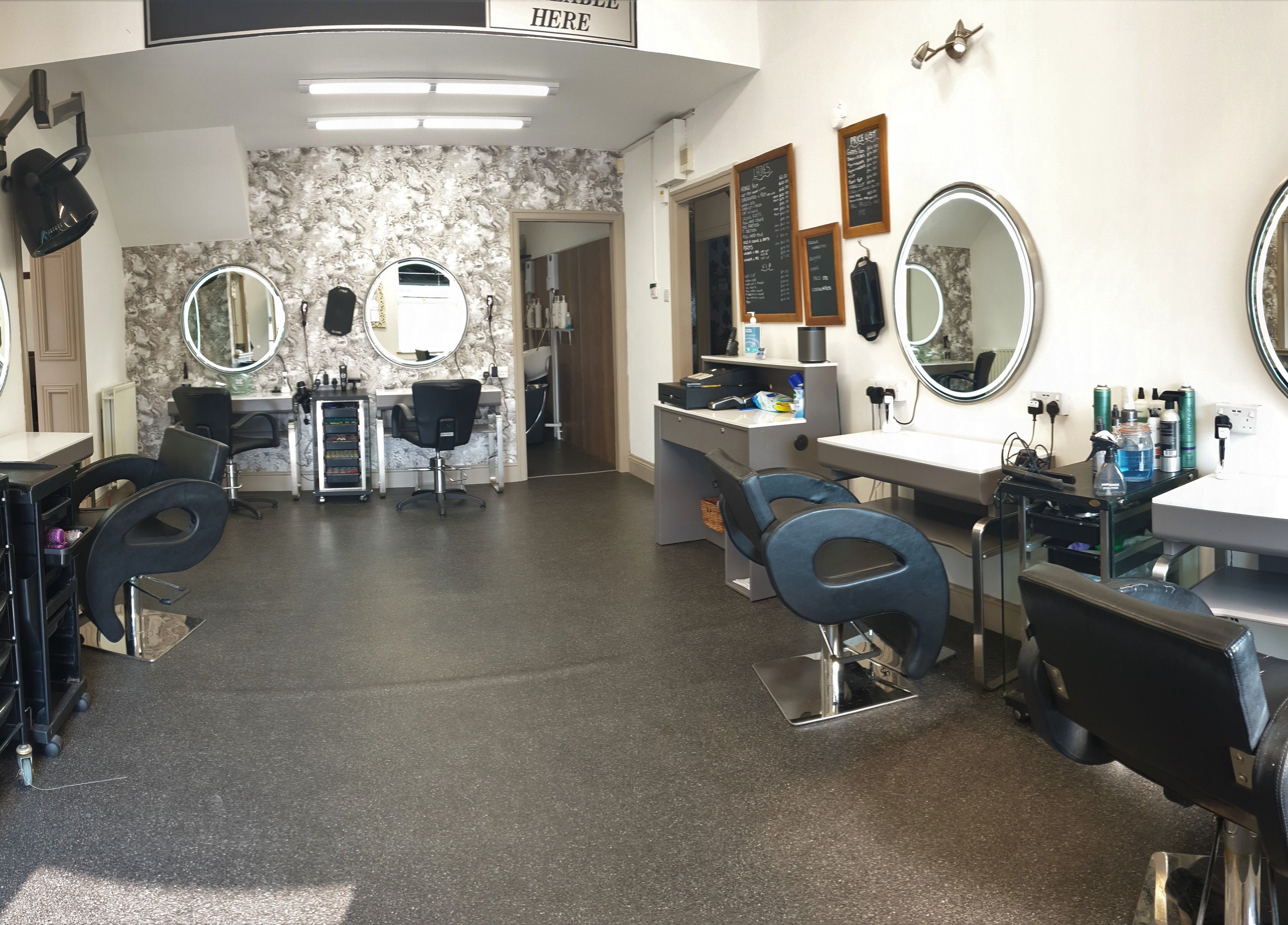 Modern salon chairs and mirrors at Sweeneys Catterick, Catterick Garrison, England, GB.