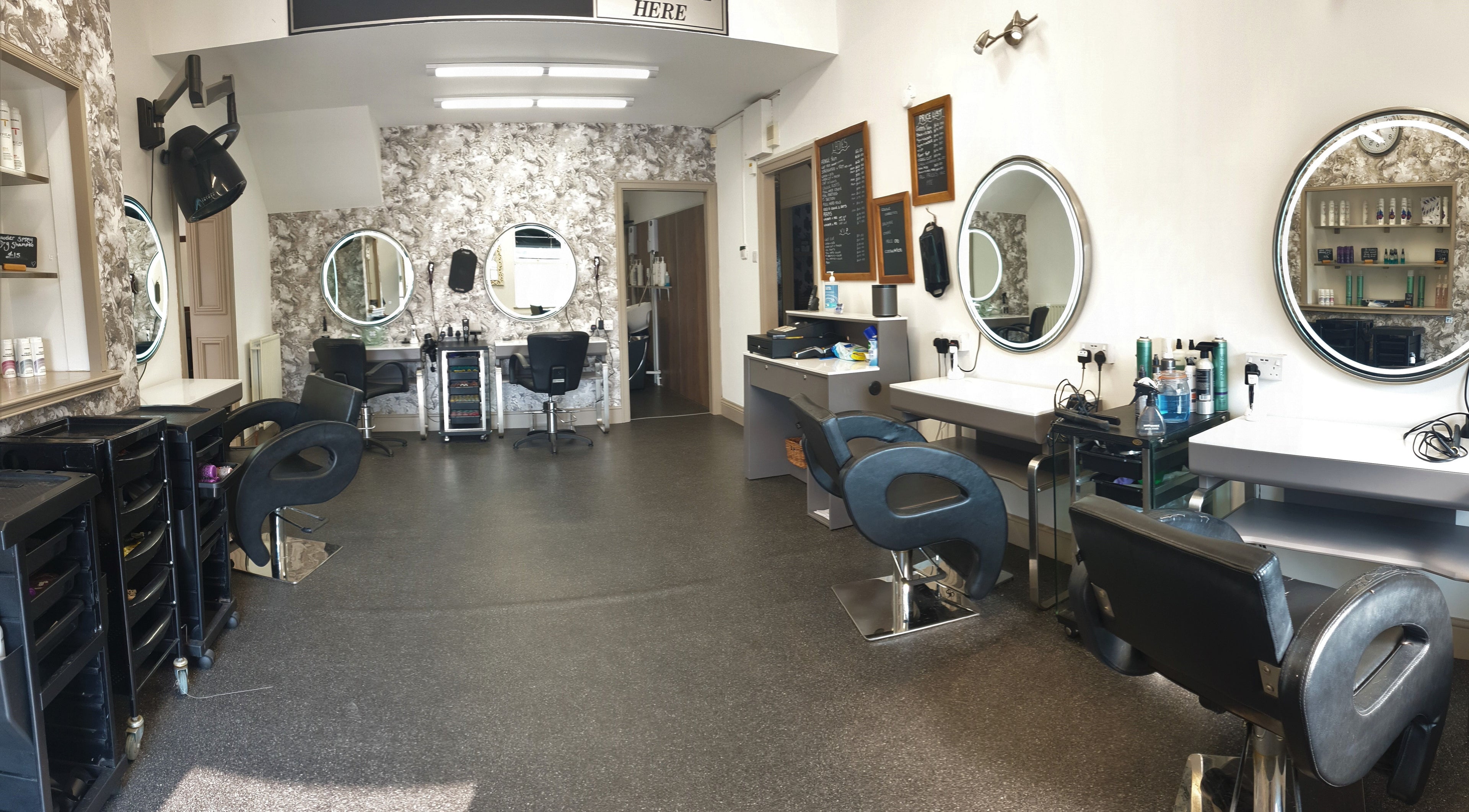 Modern salon chairs and mirrors at Sweeneys Catterick, Catterick Garrison, England, GB.