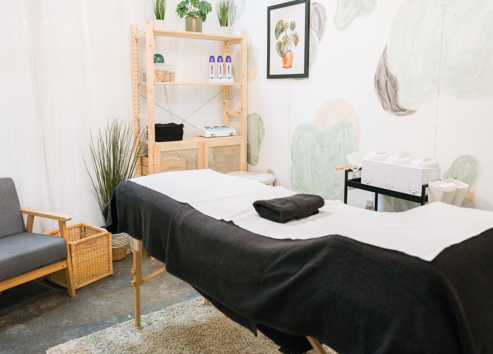 Relaxing treatment room at Wax Pot London, London, England, GB, featuring a comfortable massage bed and soothing decor.