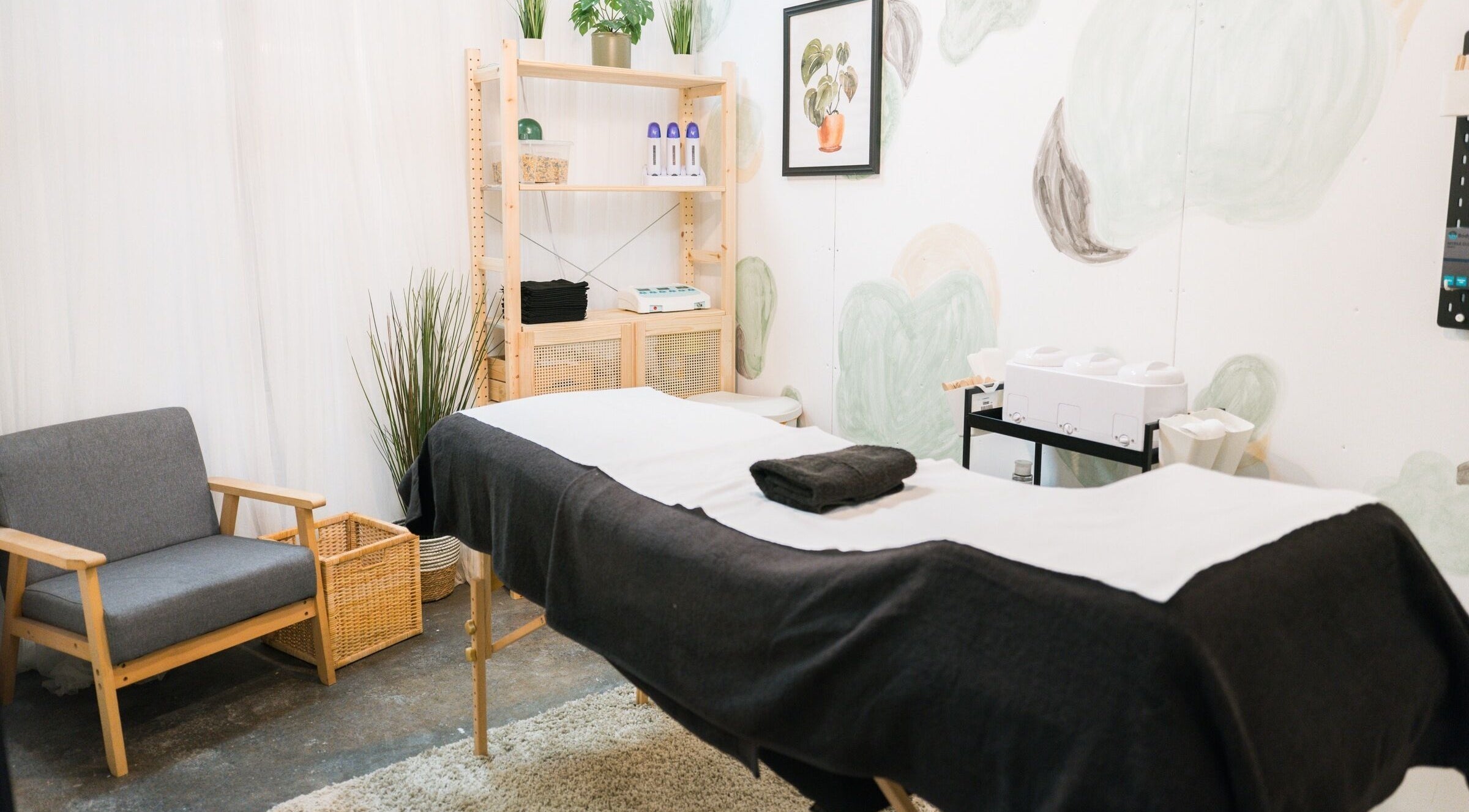 Relaxing treatment room at Wax Pot London, London, England, GB, featuring a comfortable massage bed and soothing decor.