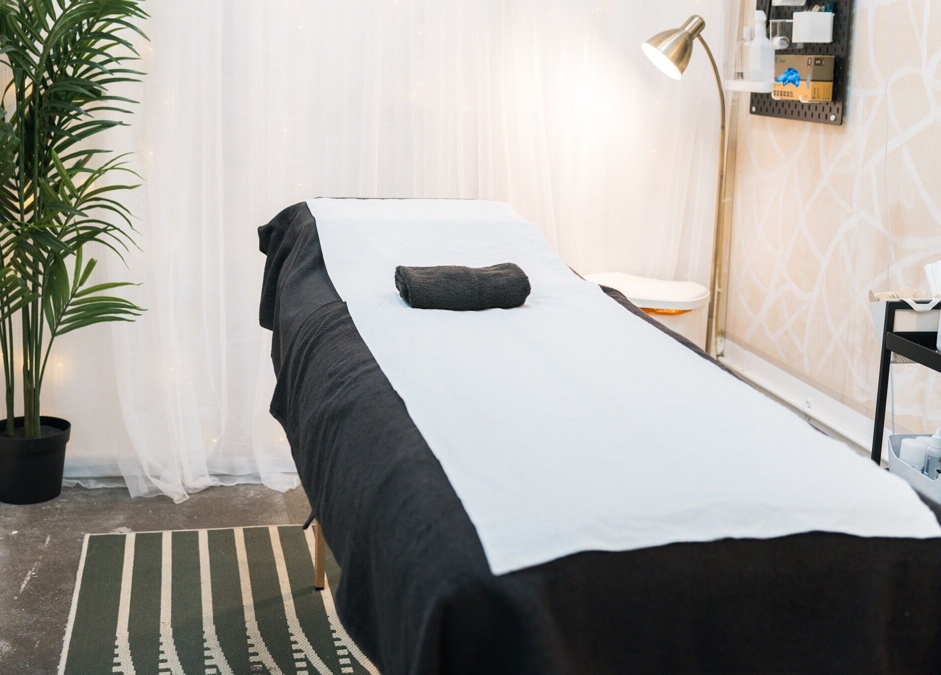Tranquil treatment room at Wax Pot London, featuring a massage table in London, England, GB.