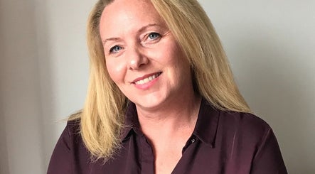 Friendly acupuncturist at Bespoke Acupuncture Upper Street, London, England, GB, ready to welcome clients.