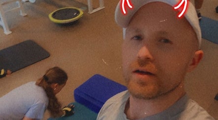 People exercising at MarkSpeakForm gym, Howell, Michigan, US, showcasing vibrant fitness atmosphere.