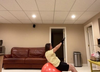 A person exercises on a stability ball at MarkSpeakForm, Howell, Michigan, US.