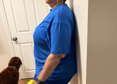 A person exercising with a dog at Marks Peak Form, Howell, Michigan, US.