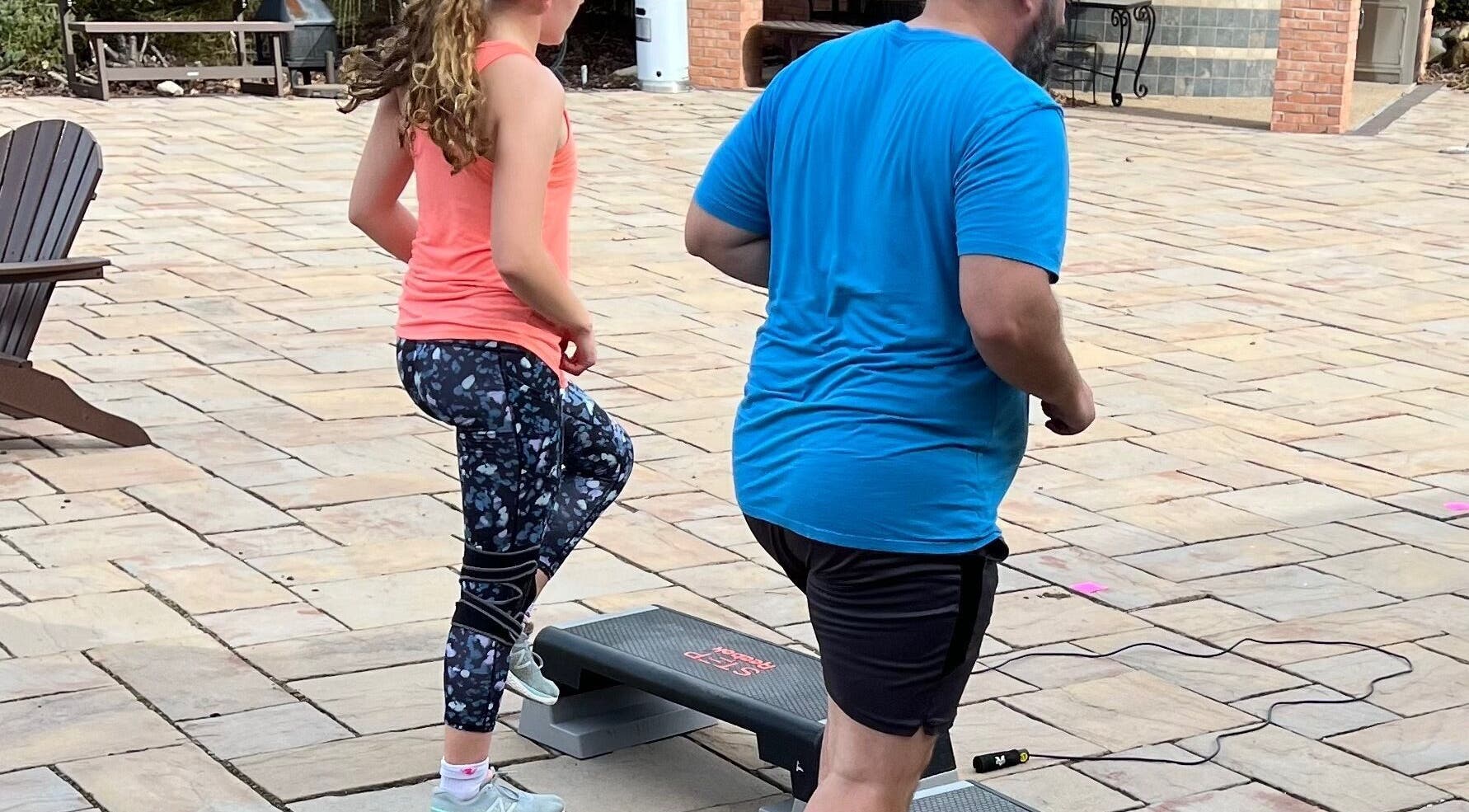 People exercising on steps at Marks Peak Form, Howell, Michigan, US, enhancing wellness routines.
