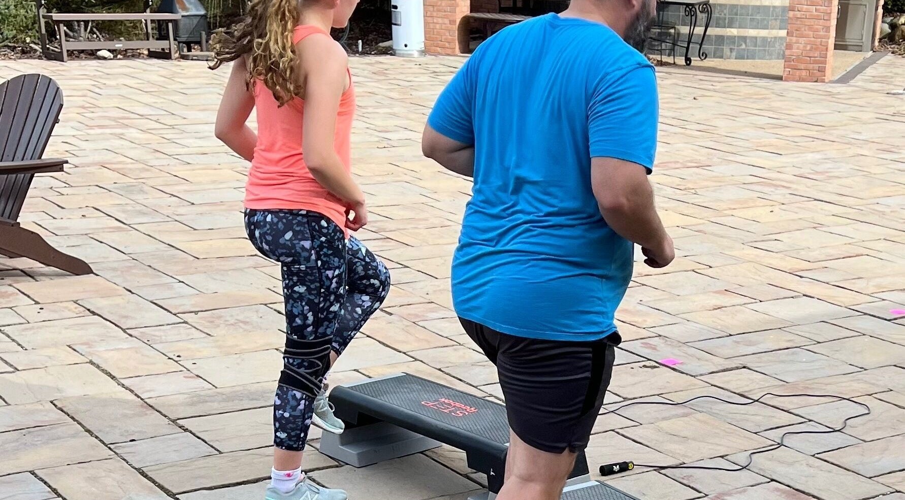 People exercising on steps at Marks Peak Form, Howell, Michigan, US, enhancing wellness routines.