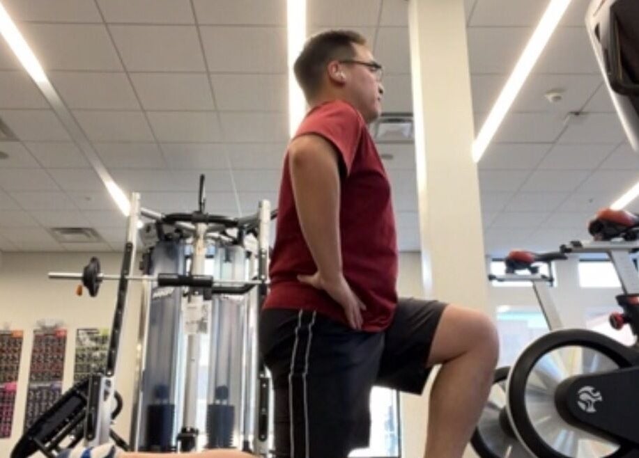 Person exercising at gym in Marks Peak Form, Howell, Michigan, US. Modern fitness equipment visible.