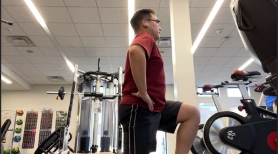 Person exercising at gym in Marks Peak Form, Howell, Michigan, US. Modern fitness equipment visible.