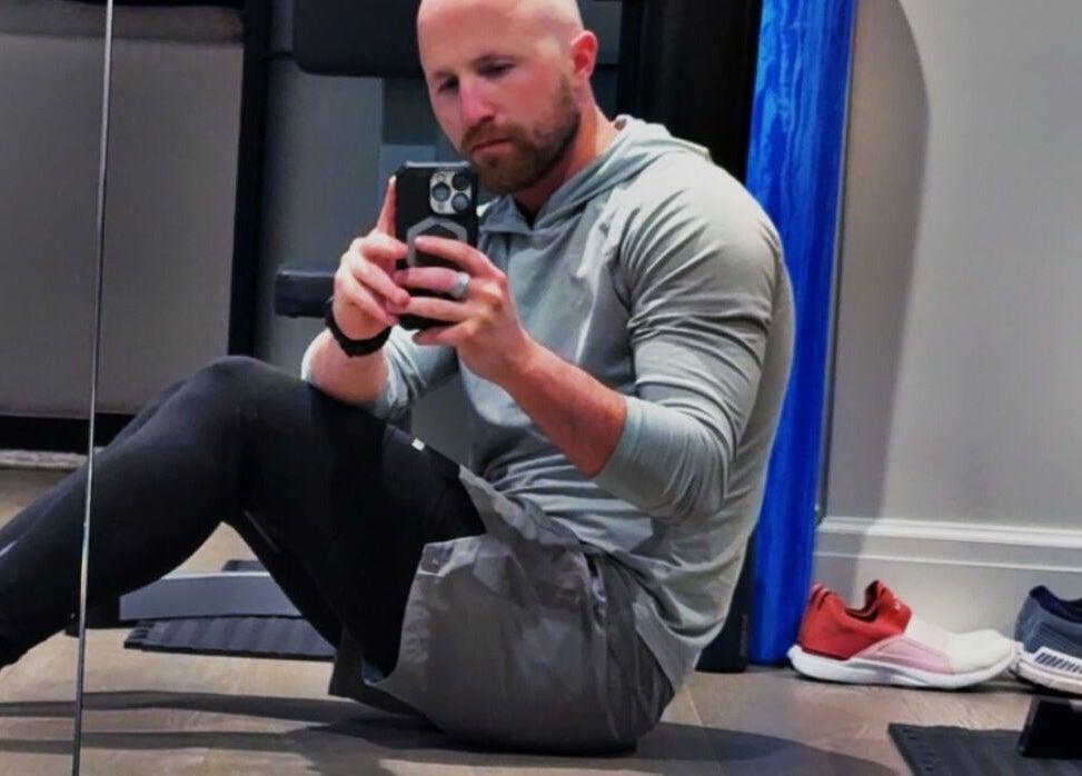 Person capturing a selfie inside Marks Peak Form gym, Howell, Michigan, US.