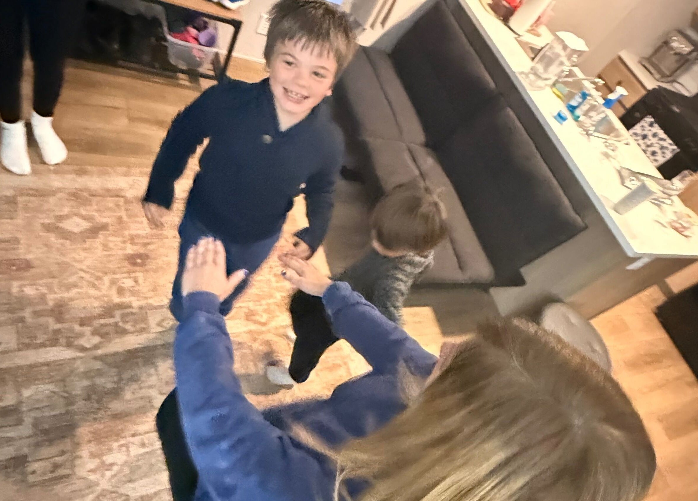 Children playing and laughing inside Marks Peak Form, Howell, Michigan, US, showcasing joyful moments.