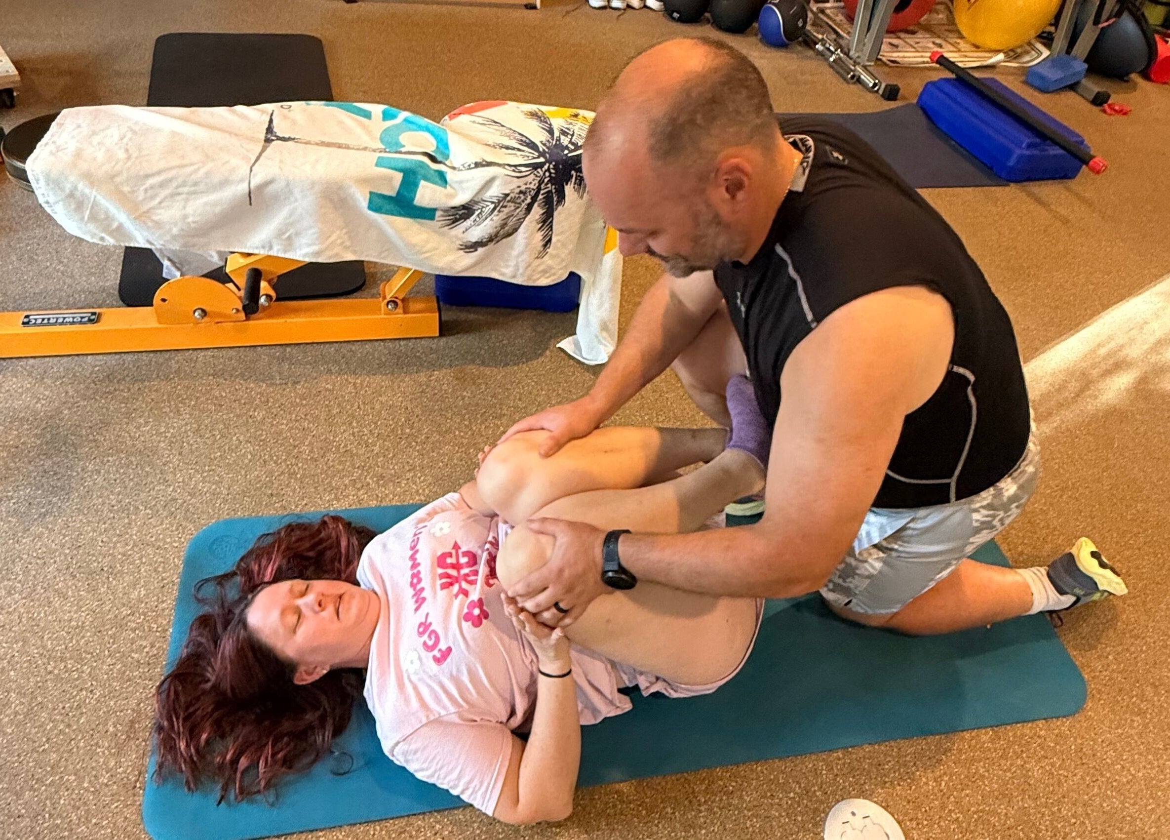 Personal training session at Marks Peak Form, Howell, Michigan, US, focusing on flexibility.