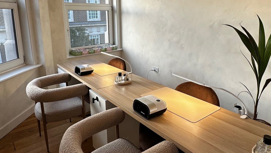 Modern nail station at Lani Nails London offers chic ambiance in London, GB with natural light.