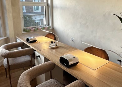 Modern nail station at Lani Nails London offers chic ambiance in London, GB with natural light.