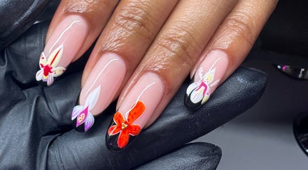 Intricate floral nail art at Lani Nails London, showcasing vibrant designs. Location: London, GB.