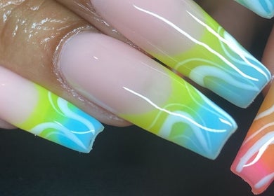 Colorful gradient nail art at Lani Nails London, London, GB. Vibrant design with intricate details.
