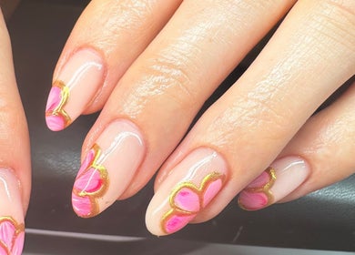 Elegant pink and gold nail art at Lani Nails London, London, GB, showcasing intricate petal designs.