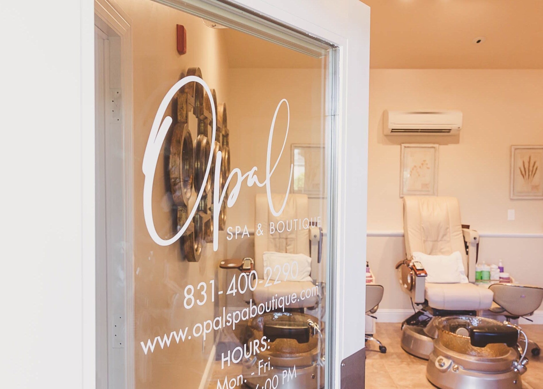 Entrance to Opal Spa and Boutique, Santa Cruz, California, showing a cozy interior with a massage chair.