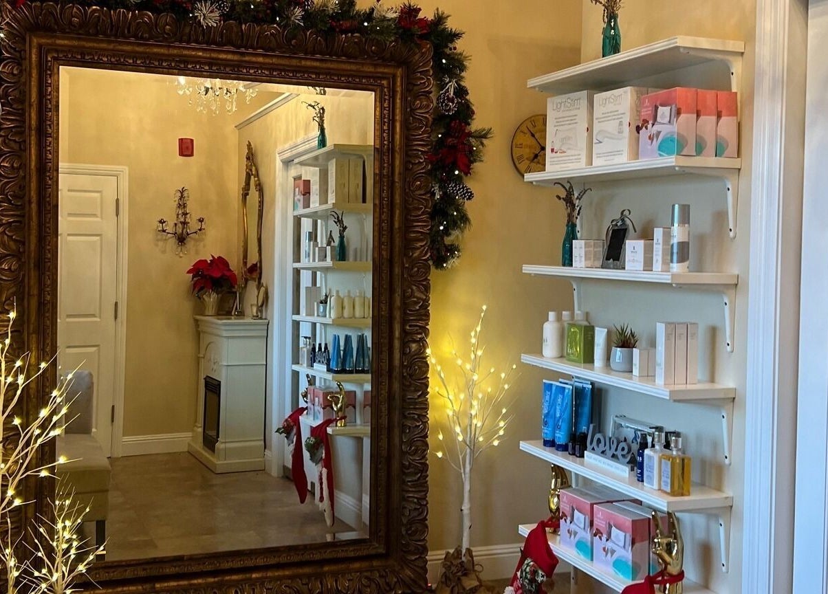 Elegant interior decor at Opal Spa and Boutique, Santa Cruz, California, US showcasing products and festive decor.