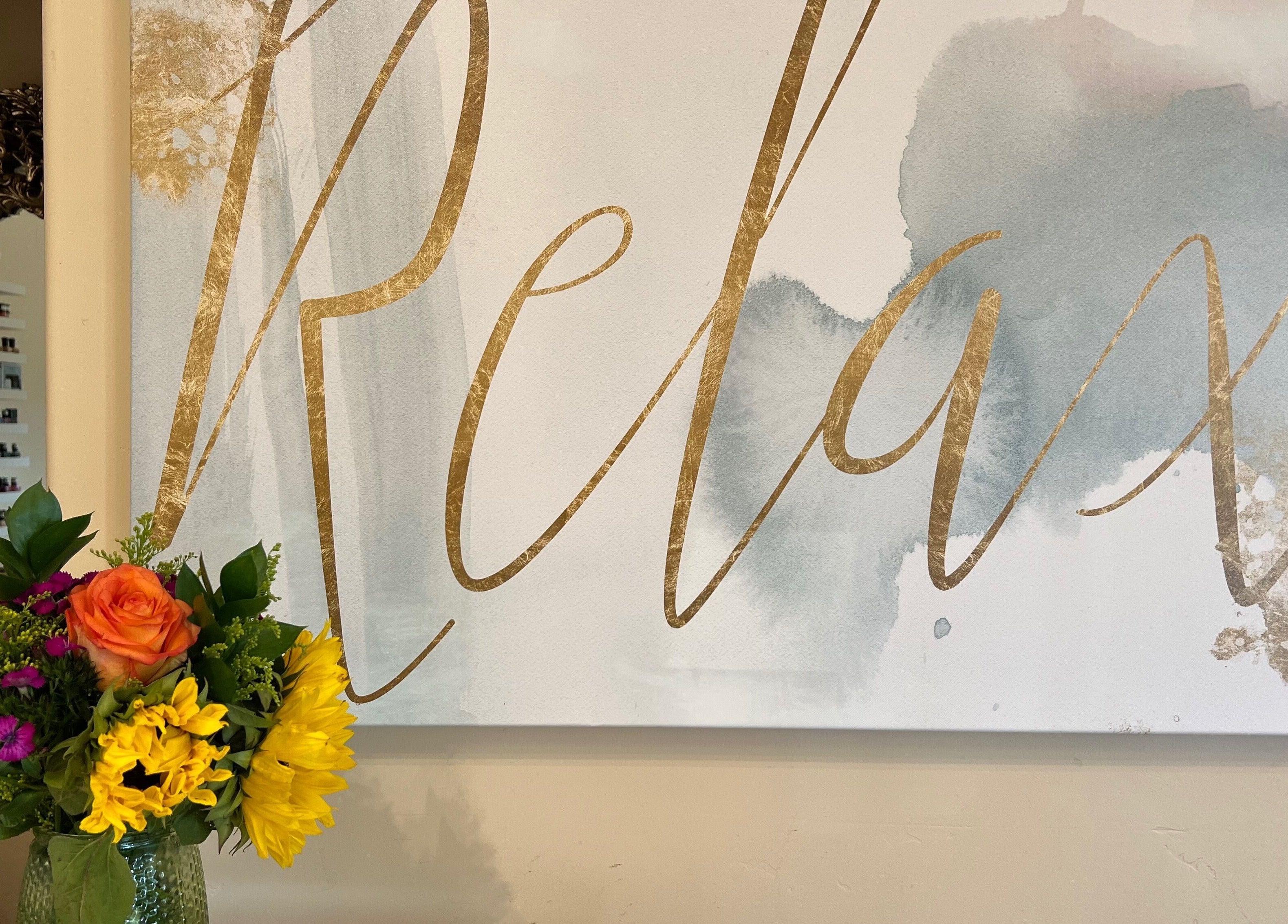 Relax sign and vibrant flowers at Opal Spa and Boutique, Santa Cruz, California, US.