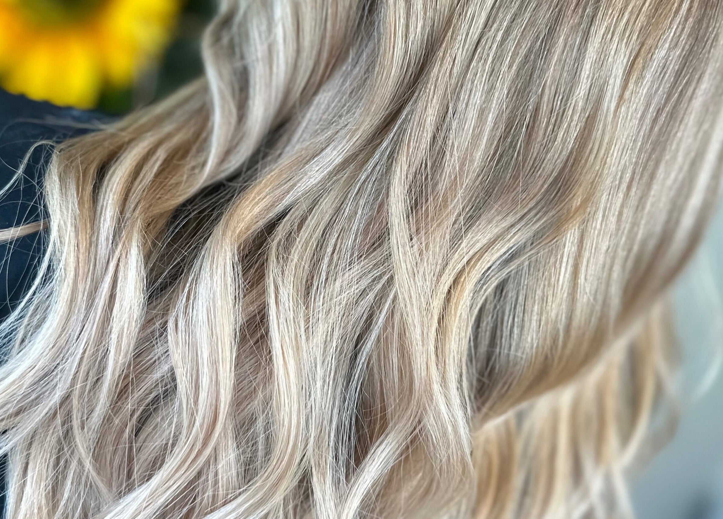 Flowing golden-blonde hair styled at Thistles by Bethany Danielle Hair, Carlisle, England, GB.