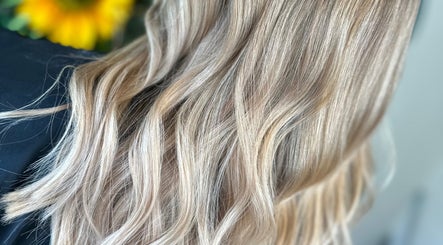Flowing golden-blonde hair styled at Thistles by Bethany Danielle Hair, Carlisle, England, GB.