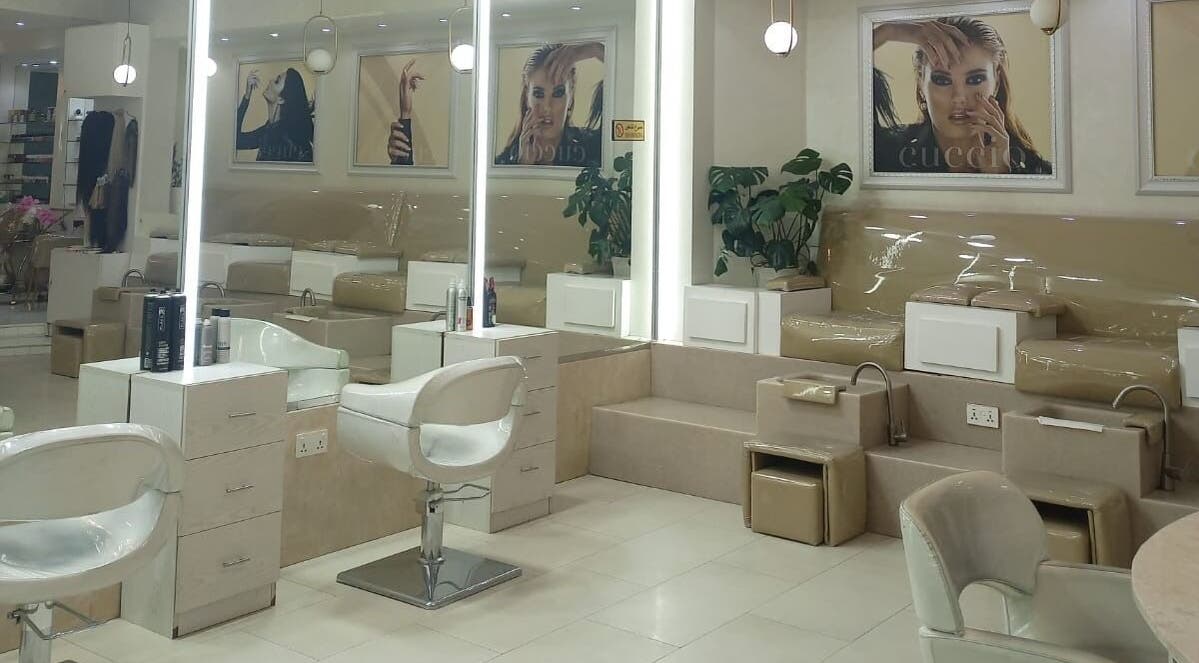Spacious interior of House of Nails, Dubai, featuring luxurious nail stations for an elegant beauty experience.