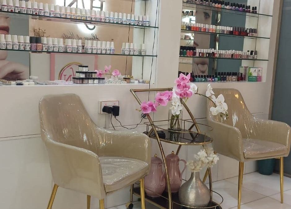 Elegant nail polish display and seating area at House of Nails, Dubai, dubai fairmont, AE.