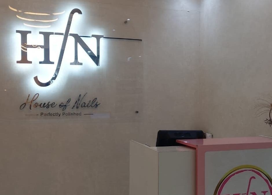 Elegant reception area at House of Nails, Dubai Fairmont, AE, showcasing modern decor and welcoming atmosphere.