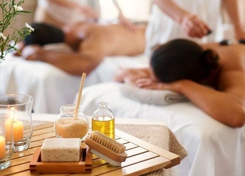 Couples massage at IHB Salon n Spa, Midrand, Gauteng, ZA with candles and oil for a serene wellness experience.