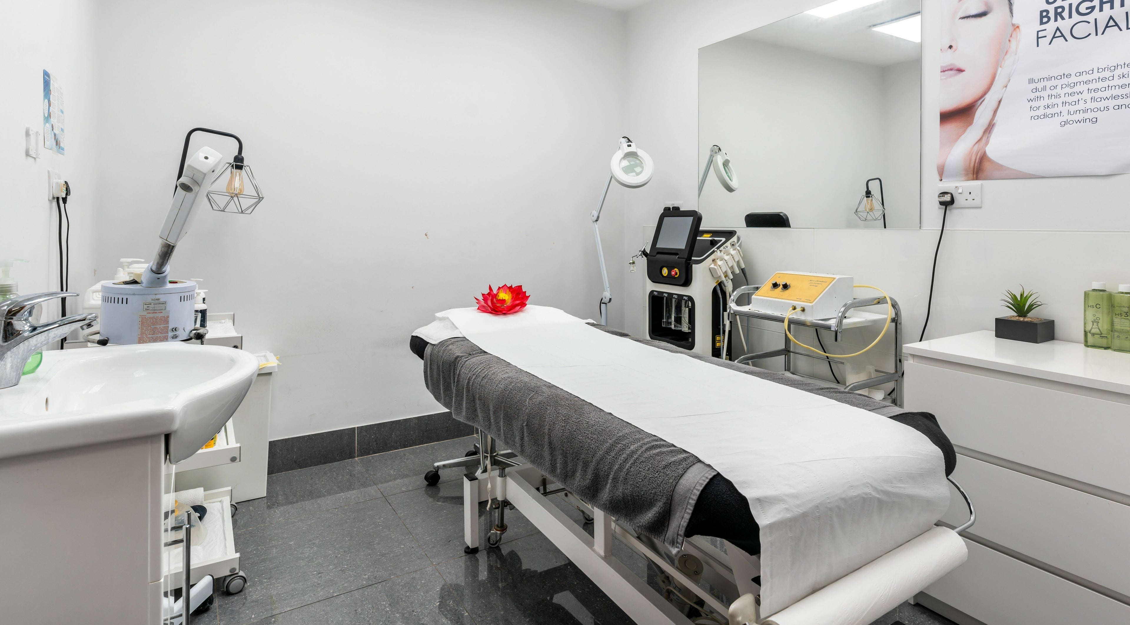 Modern treatment room at Lemoge Clinic - Edgware Road, London, England, GB with spa bed and beauty equipment.