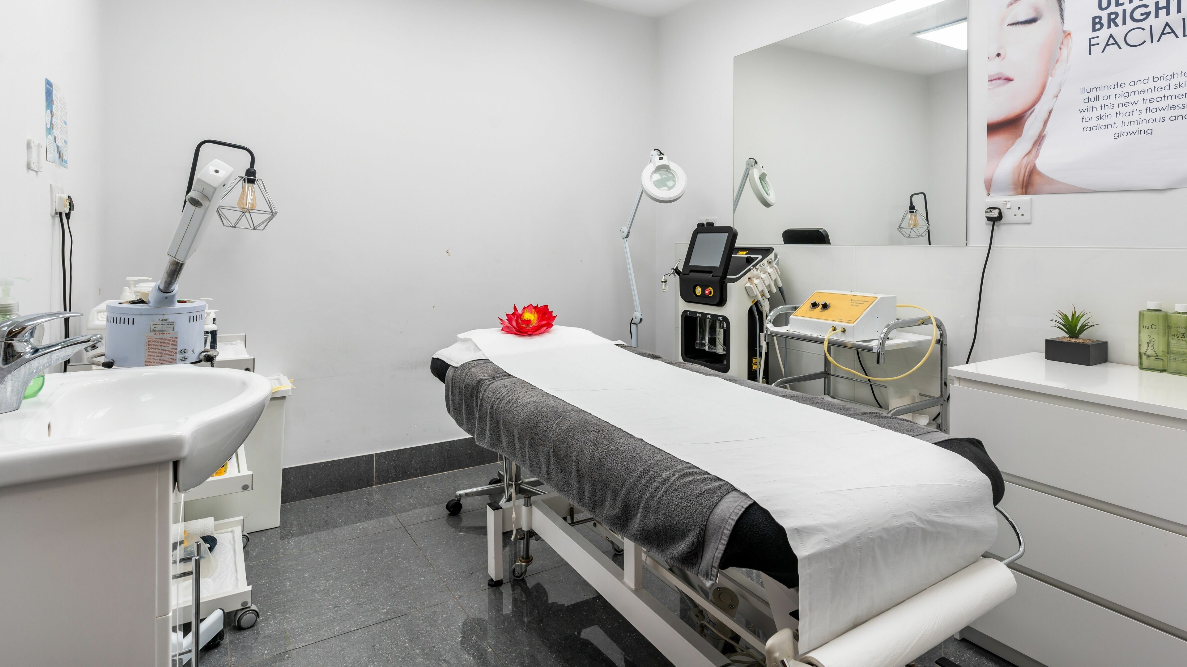 Modern treatment room at Lemoge Clinic - Edgware Road, London, England, GB with spa bed and beauty equipment.