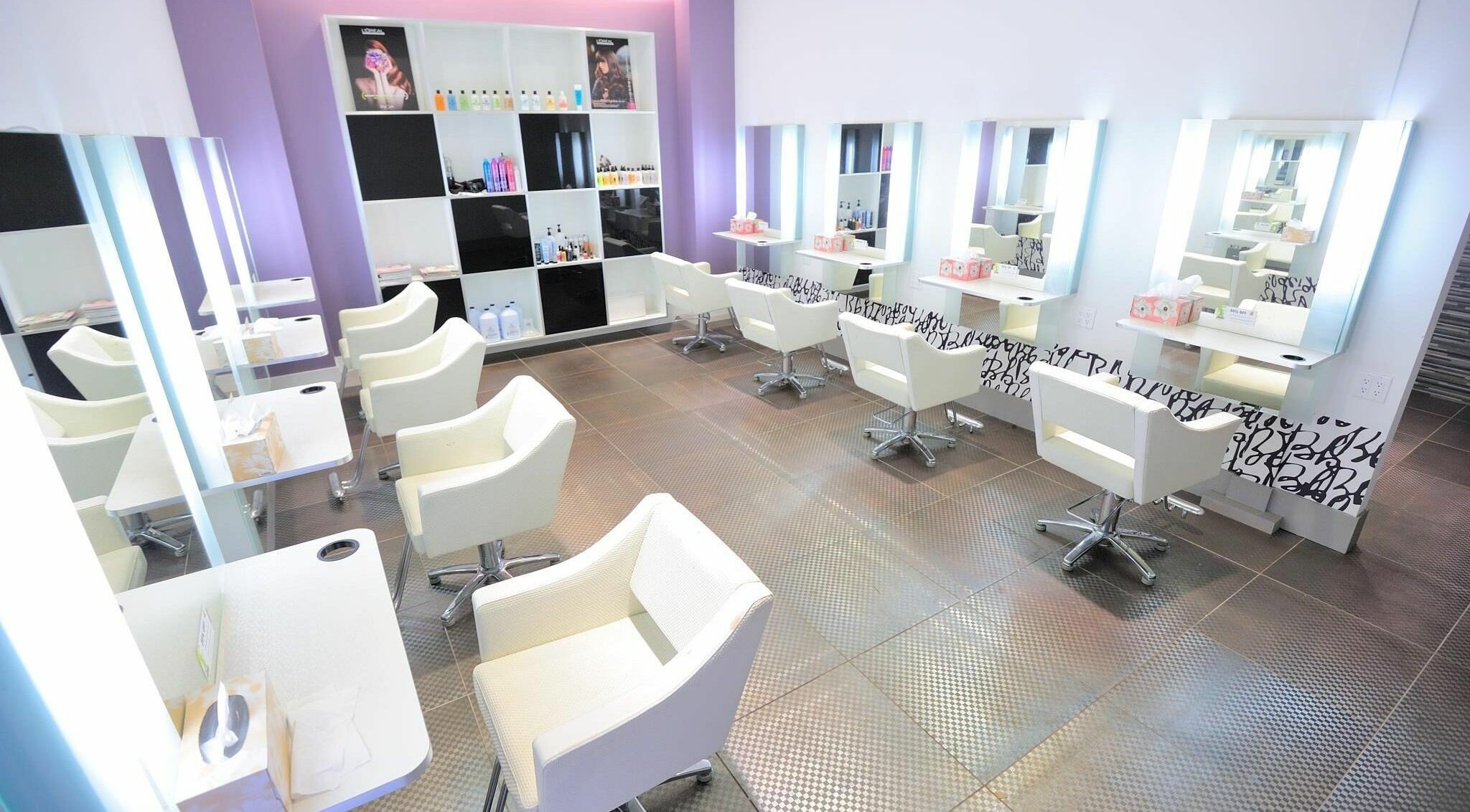 Modern interior of Muse Hair & Beauty Salon in Vancouver, British Columbia, CA, showcasing stylish workstations.