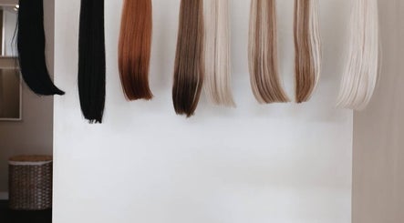 Various hair extensions at Salon 892 - Hair By Sar, Windsor, Ontario, CA display diverse color options.