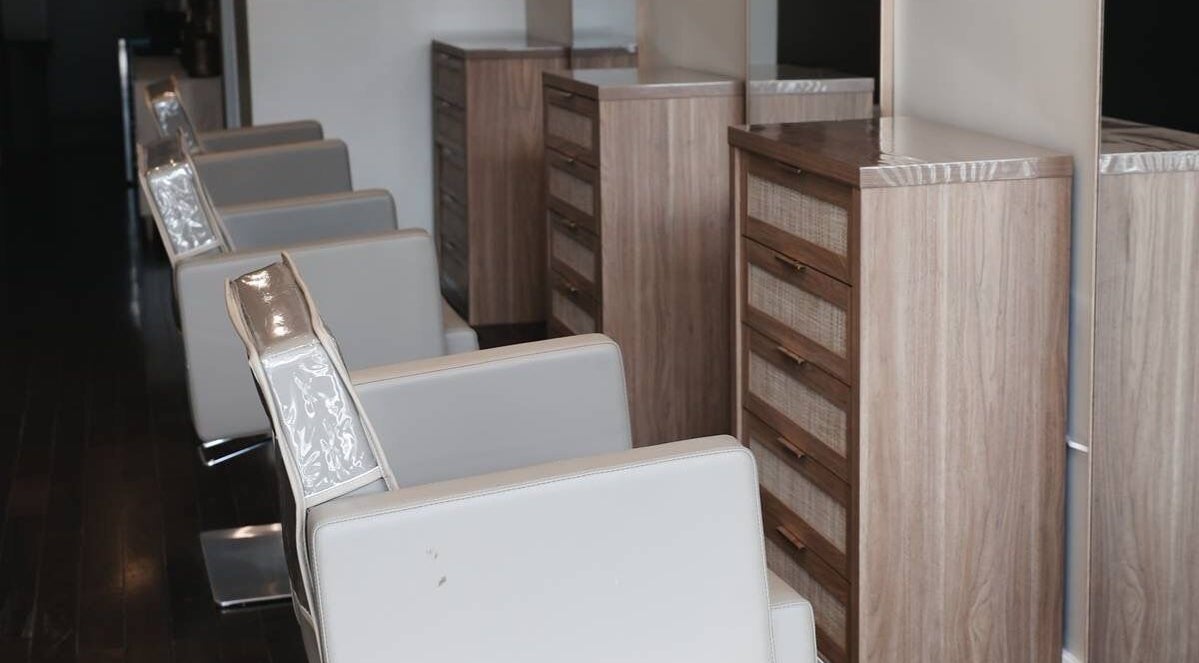 Modern salon chairs at Salon 892 - Hair By Sar in Windsor, Ontario, CA, offering a sleek and comfortable setting.