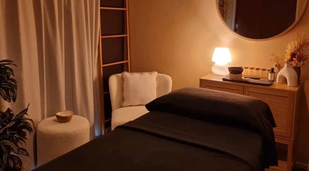 Relaxing spa room at Haven for Self, Hamilton, Waikato, NZ, featuring a massage bed and soft lighting.
