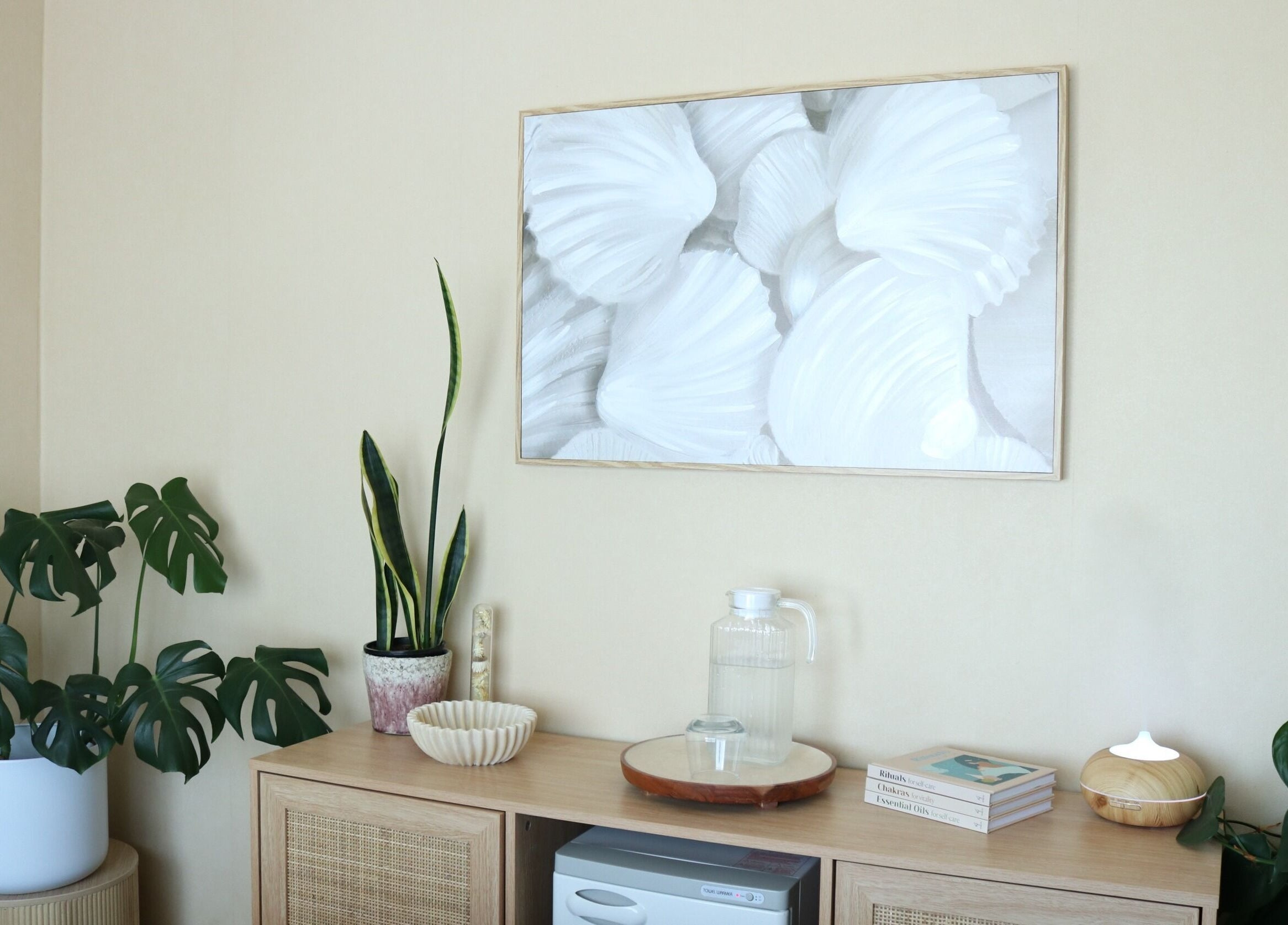 Elegant decor at Haven For Self, Hamilton, Waikato, NZ, featuring plants and art in a calming setting.