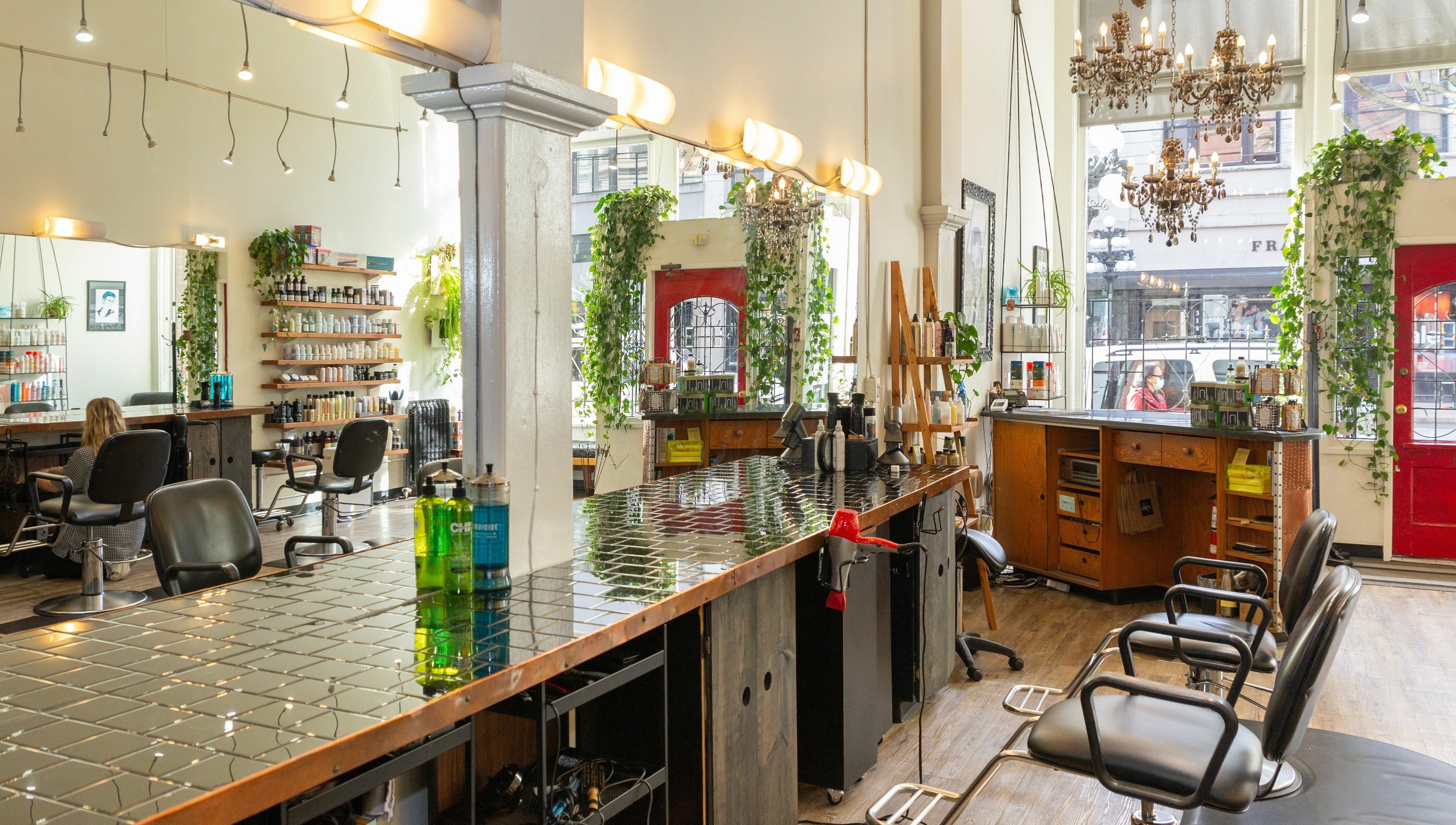 Elegant interior of Colourbox salon in Vancouver, British Columbia, CA, showcasing stylish decor and seating.
