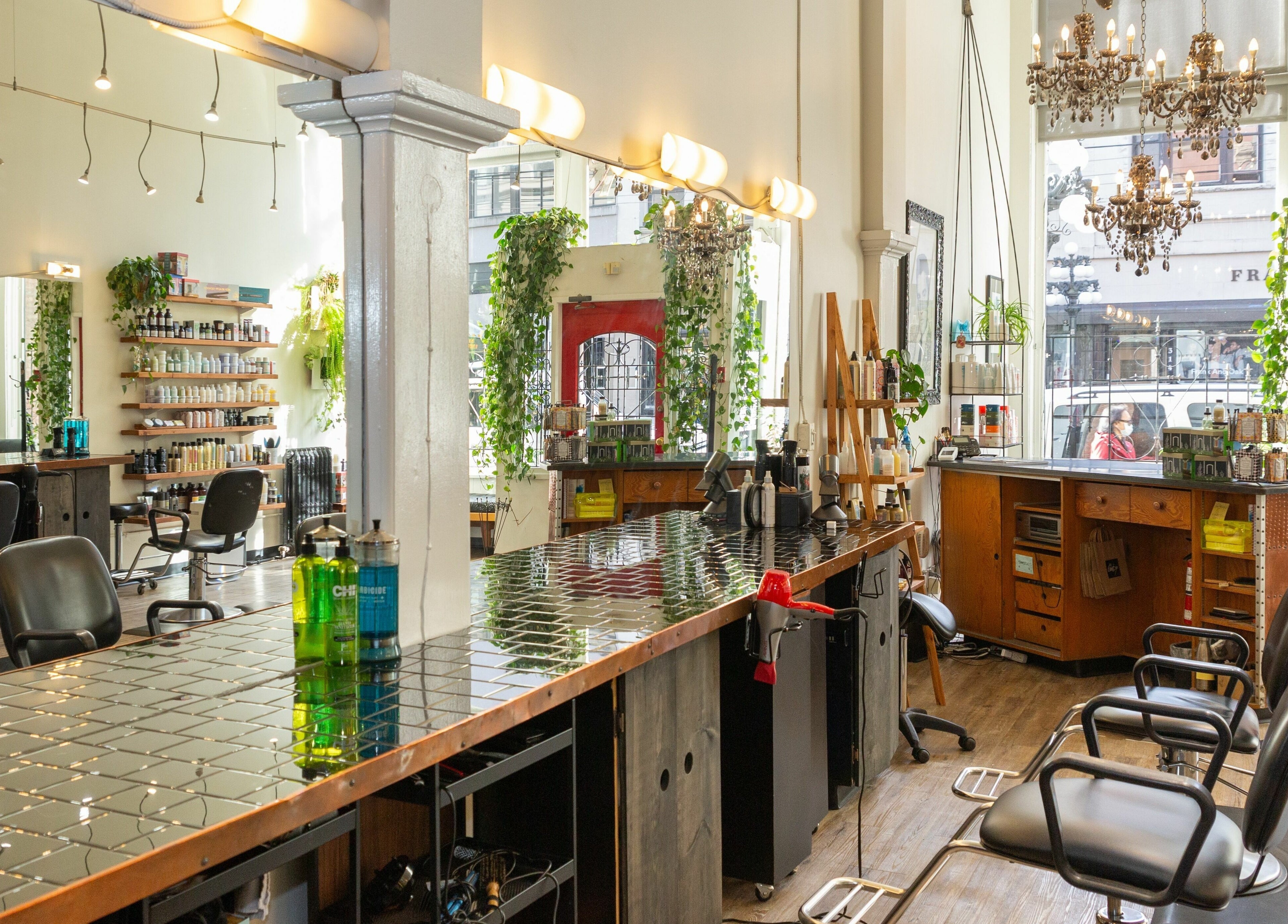 Elegant interior of Colourbox salon in Vancouver, British Columbia, CA, showcasing stylish decor and seating.