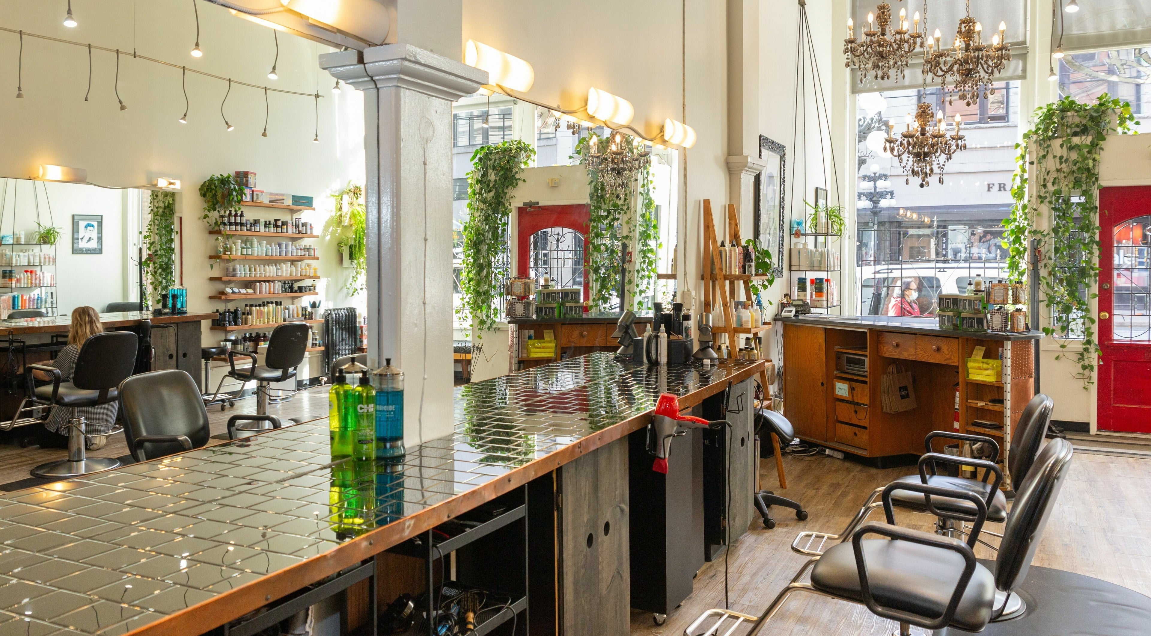 Elegant interior of Colourbox salon in Vancouver, British Columbia, CA, showcasing stylish decor and seating.