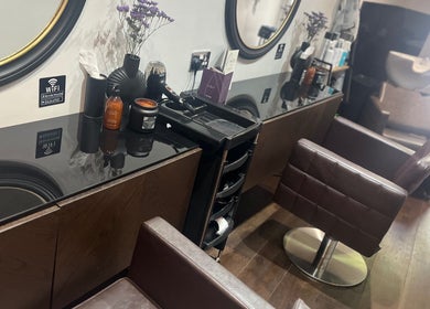 Chic interior of Amanda Jayne Hairdressing in Swalwell, England, GB showcasing styling stations.