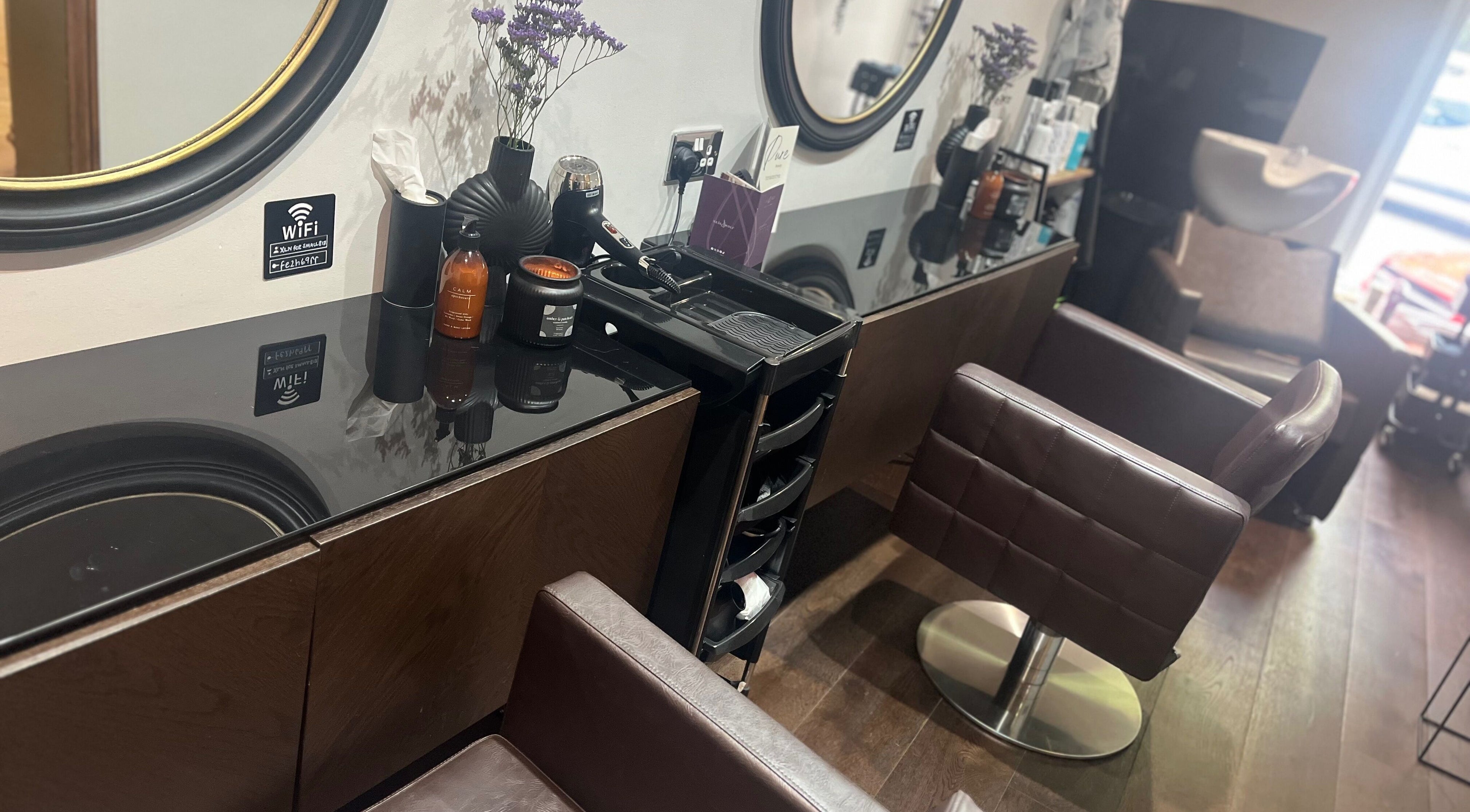 Chic interior of Amanda Jayne Hairdressing in Swalwell, England, GB showcasing styling stations.