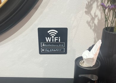 Amanda Jayne Hairdressing salon WiFi display next to vase in Swalwell, England, GB.
