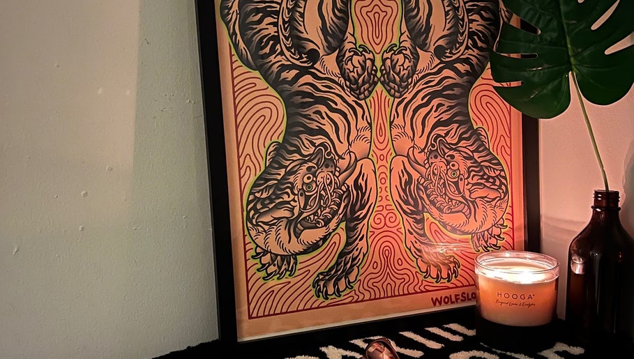 Artistic tiger print with candle decor at Tōji in Singapore, Singapore, SG for a serene ambiance.