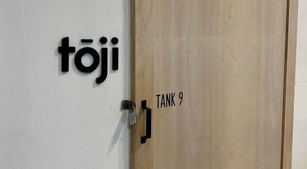 Entrance of Tōji in Singapore, Singapore, SG with a visible lock and sign.