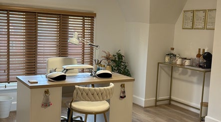 Elegant manicure station at C Beauty Studio in Nottingham, England, GB, with cozy seating and warm lighting.