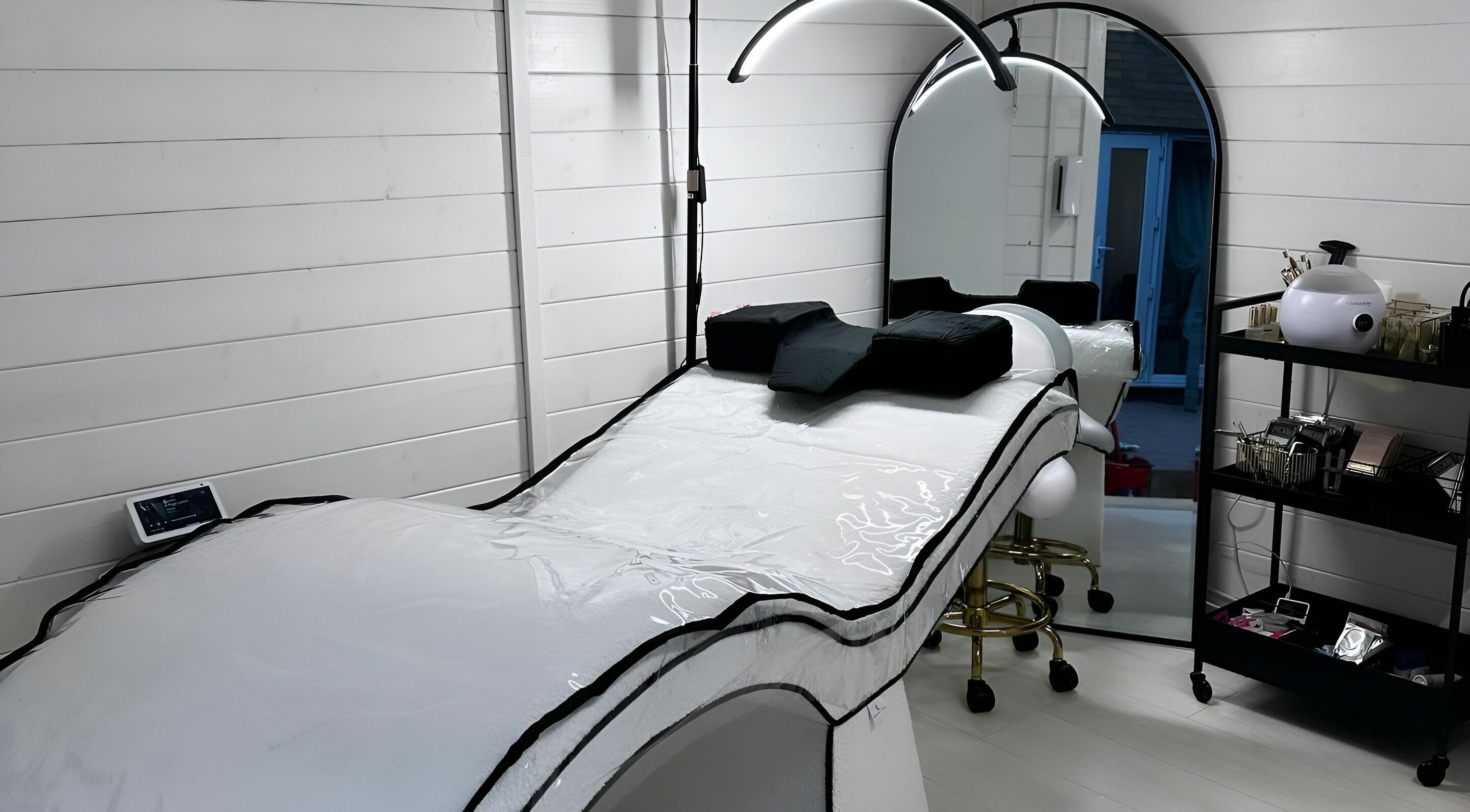 Chic treatment room at Belleza, Stevenage, England, GB, featuring modern equipment for wellness services.